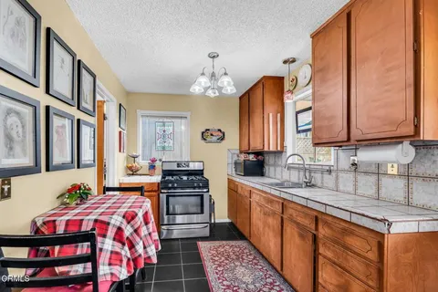 a bedroom with a bed and a view of living room