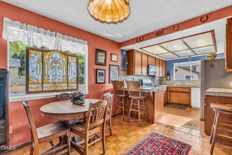 a very nice looking kitchen with a large window
