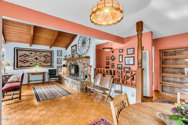 a kitchen with stainless steel appliances granite countertop a sink a stove and cabinets