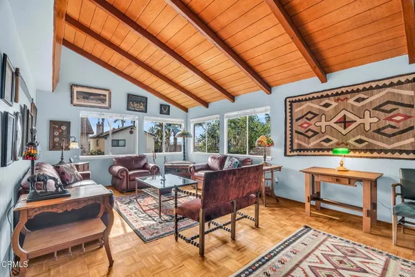 a living room with furniture and a rug