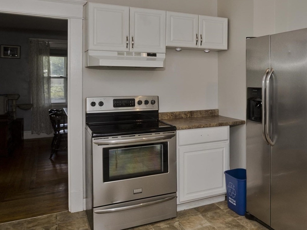 13 Granger Street Springfield, MA 01119 - Photo 18 of 41 a kitchen with cabinets and stainless steel appliances
