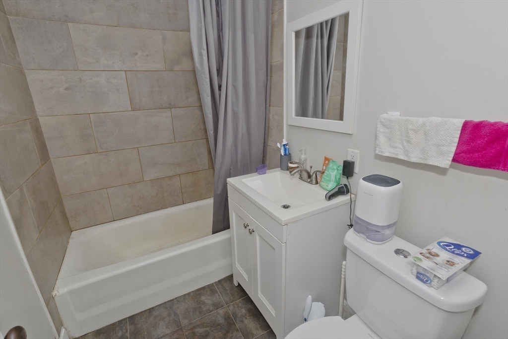 13 Granger Street Springfield, MA 01119 - Photo 27 of 41 a bathroom with a sink and a bathtub