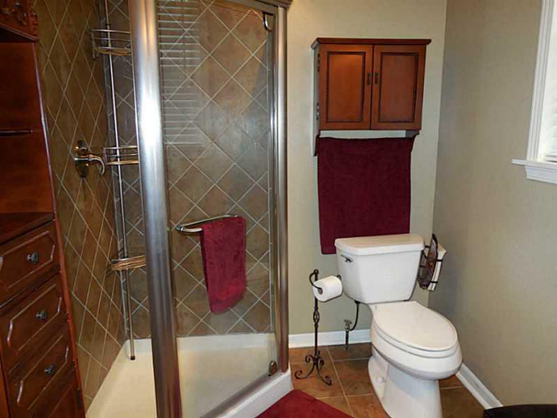 1301 Pine Hollow Road McKees Rocks, PA 15136 - Photo 13 of 24 Full Bath. First floor full bath includes ceramic tile, corner glass shower with rain shower head.