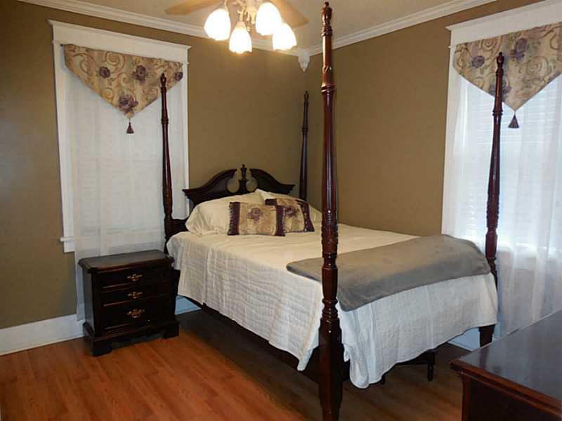 1301 Pine Hollow Road McKees Rocks, PA 15136 - Photo 18 of 24 Bedroom. The second bedroom has laminate flooring and crown molding.