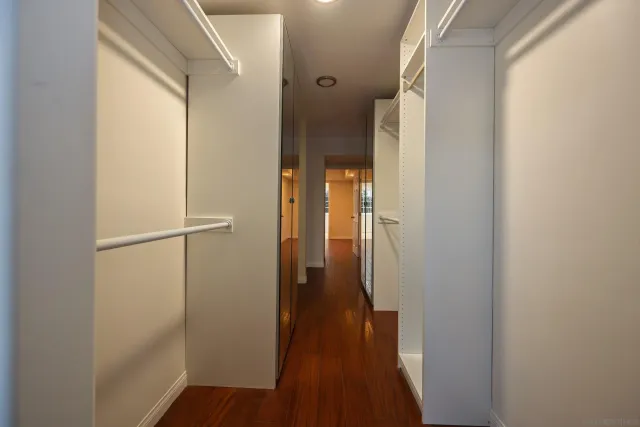 a kitchen with stainless steel appliances a refrigerator and a stove top oven