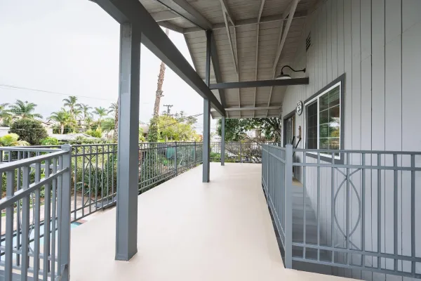 a large kitchen with stainless steel appliances a refrigerator and a sink