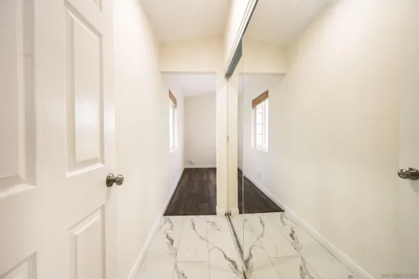 a view of a livingroom with furniture and wooden floor