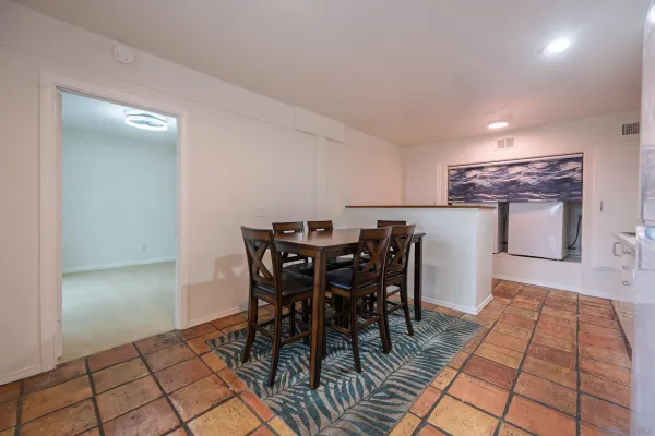 a kitchen with stainless steel appliances a refrigerator and a stove top oven