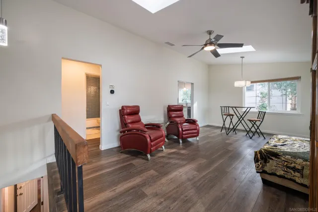 a view of a dining room with furniture and chandelier