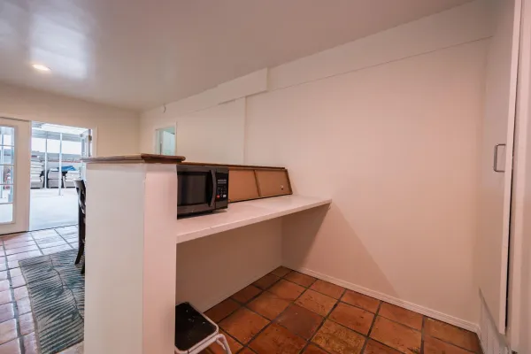 a spacious bedroom with a bed and a walk in closet