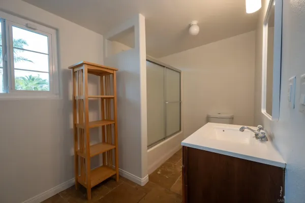 a view of a house with backyard stove and sitting area