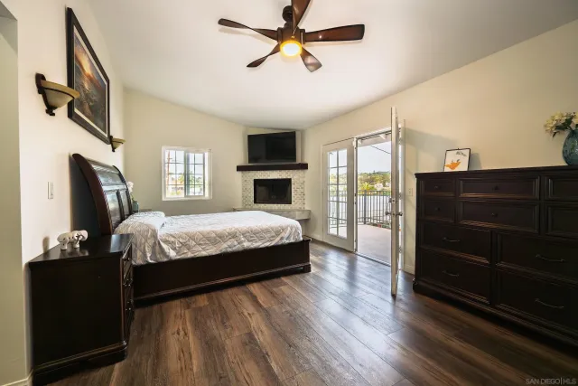 a bathroom with a granite countertop sink a mirror and a shower