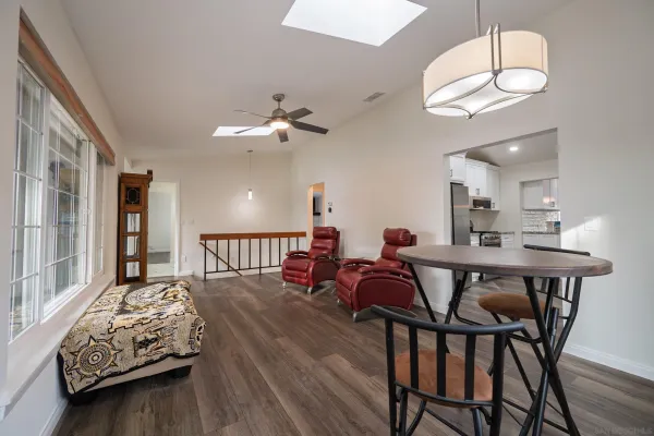 a bedroom with a bed dresser and a flat screen tv