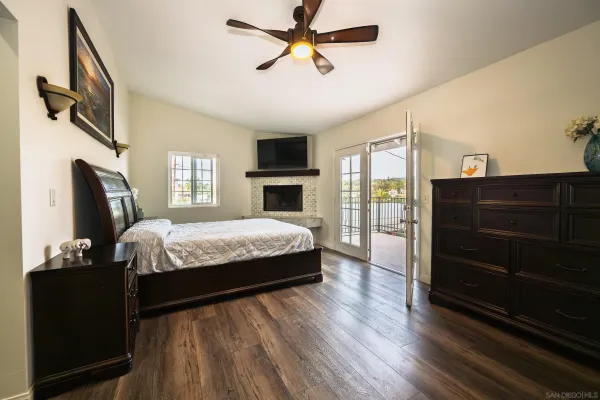 a bedroom with a bed and a fireplace