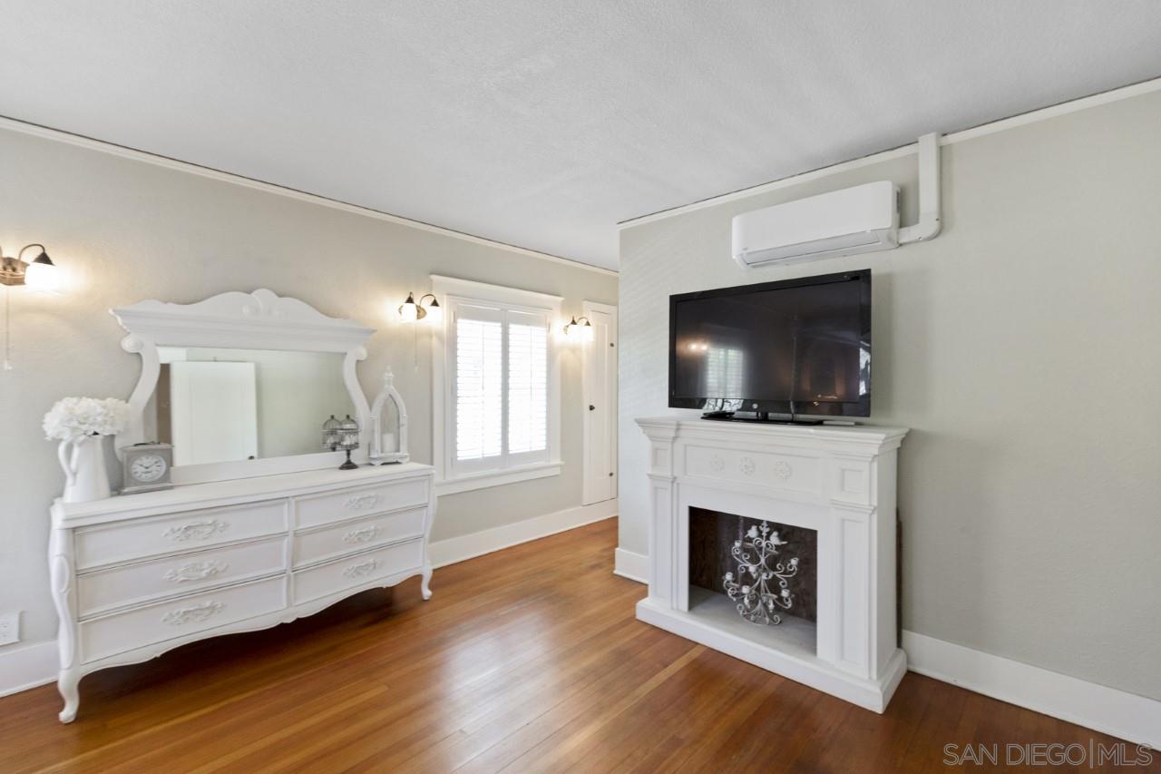 1122 Euclid Avenue Ontario, CA 91762 - Photo 19 of 51 a living room with fireplace furniture and a flat screen tv