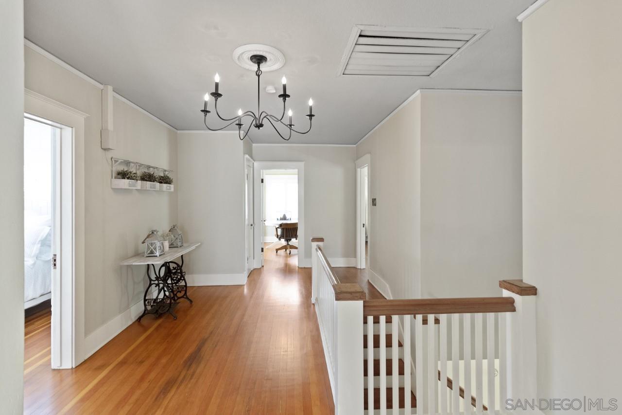 1122 Euclid Avenue Ontario, CA 91762 - Photo 23 of 51 a view of a hallway with wooden floor and staircase