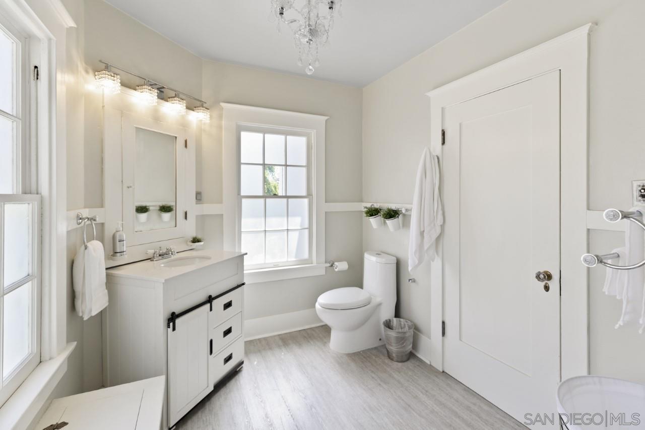 1122 Euclid Avenue Ontario, CA 91762 - Photo 26 of 51 a bathroom with a sink toilet shower and a mirror