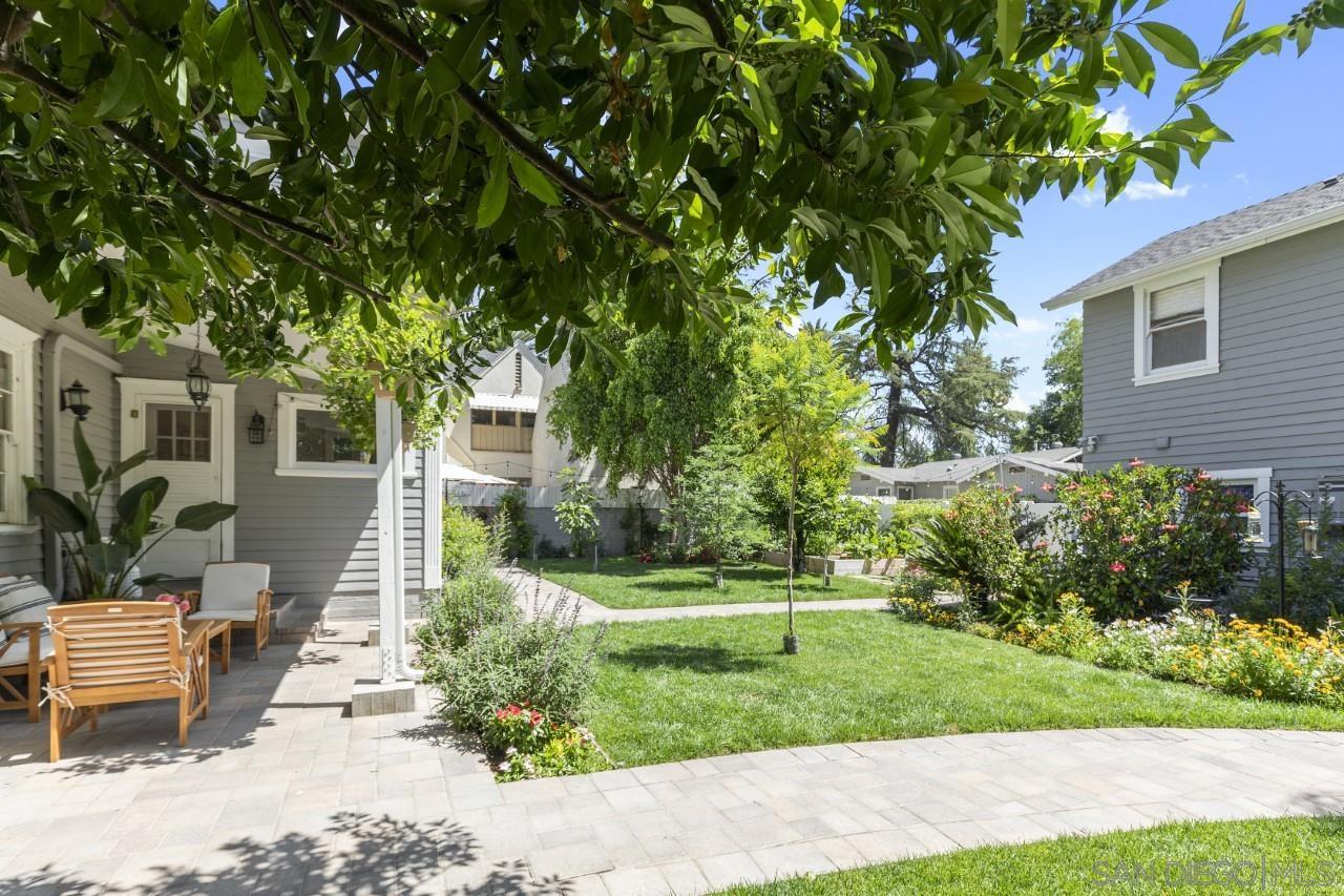 1122 Euclid Avenue Ontario, CA 91762 - Photo 33 of 51 a front view of a house with a yard and potted plants