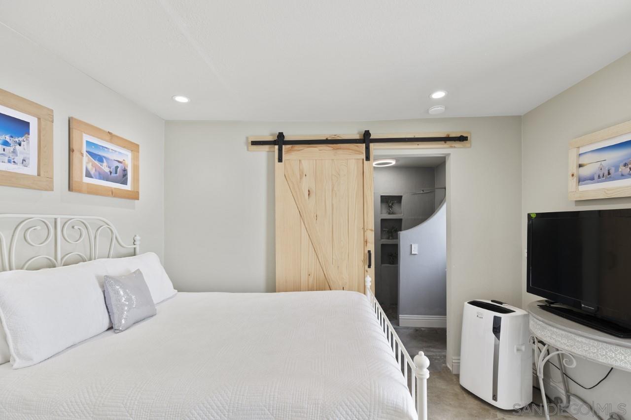 1122 Euclid Avenue Ontario, CA 91762 - Photo 38 of 51 a bedroom with a bed and a flat screen tv