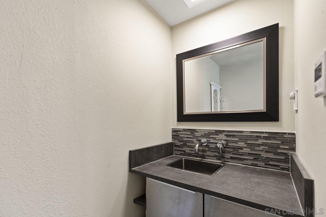 1122 Euclid Avenue Ontario, CA 91762 - Photo 41 of 51 a bathroom with a sink and a mirror