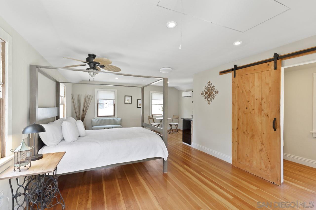 1122 Euclid Avenue Ontario, CA 91762 - Photo 45 of 51 a bedroom with a bed and wooden floor