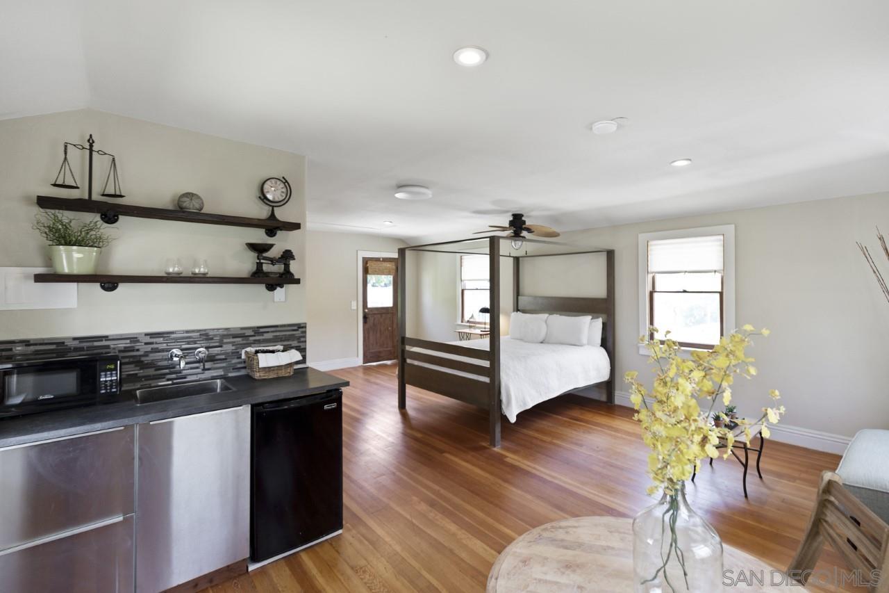1122 Euclid Avenue Ontario, CA 91762 - Photo 49 of 51 a kitchen with granite countertop a stove and a wooden floors