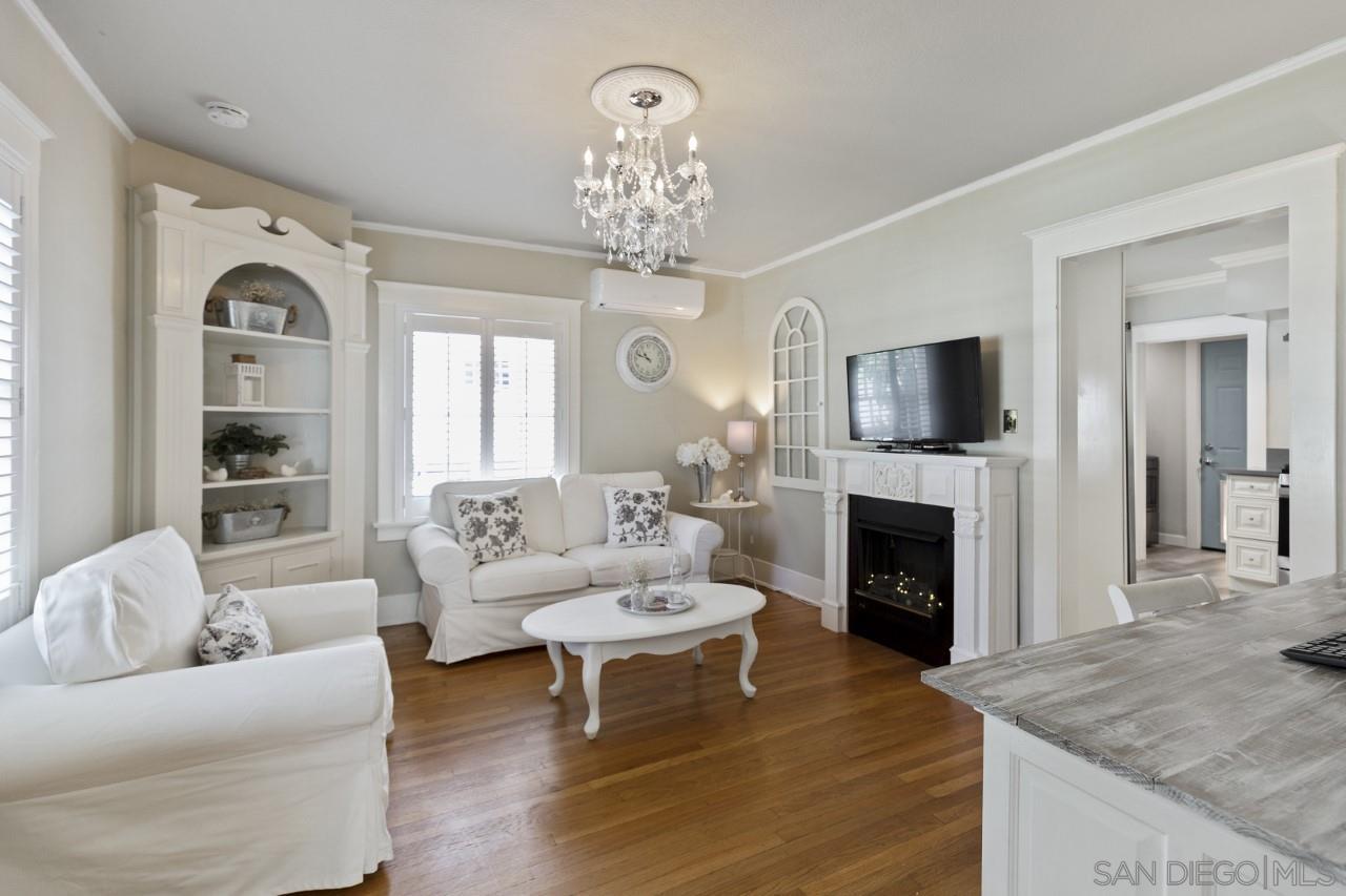 1122 Euclid Avenue Ontario, CA 91762 - Photo 8 of 51 a living room with furniture a fireplace and a flat screen tv