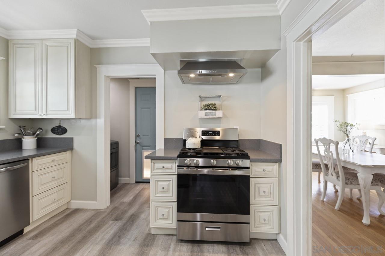 1122 Euclid Avenue Ontario, CA 91762 - Photo 10 of 51 a kitchen with a stove and white cabinets