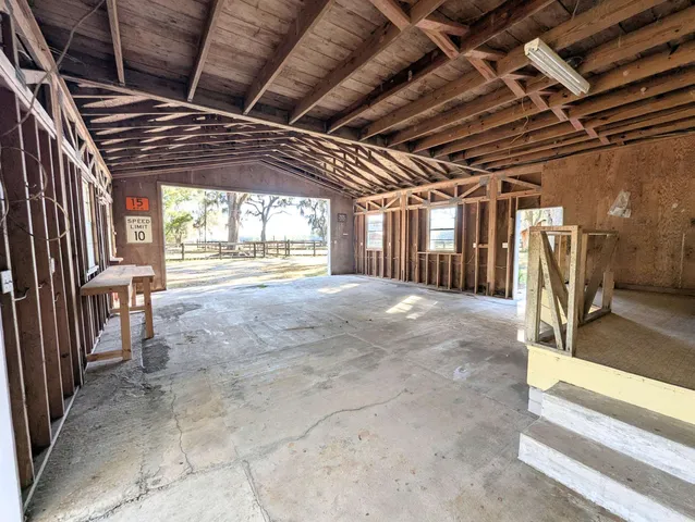 a view of an empty room with a fireplace