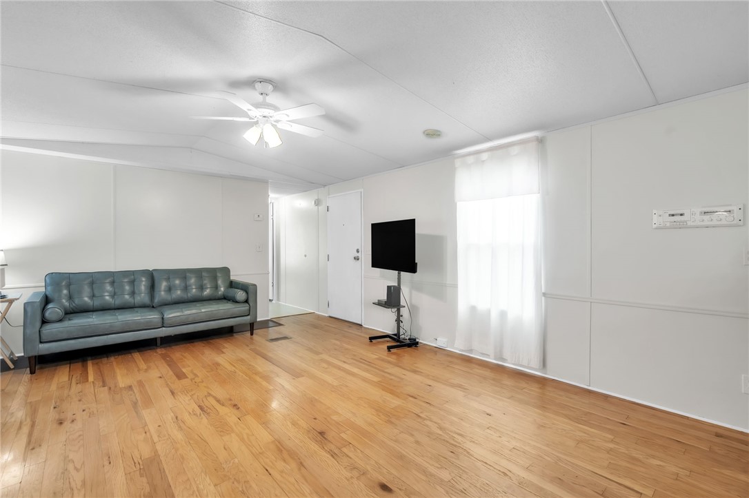 506 Charlies Creek Road Iva, SC 29655 - Photo 8 of 28 Hardwood floors and bright walls create a spacious feel in this living area.