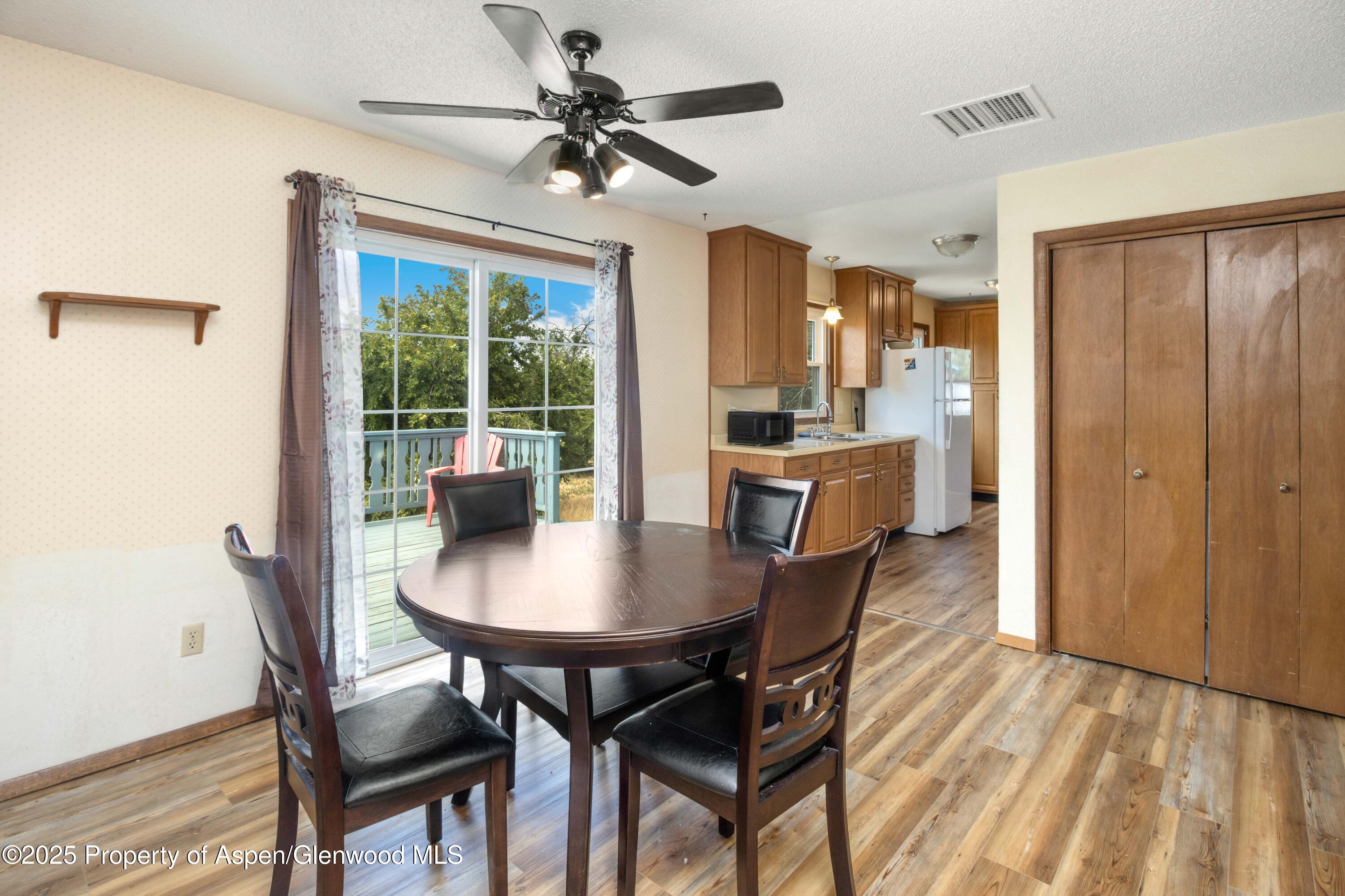 12303 West Spring Circle Eckert, CO 81418 - Photo 13 of 30 a view of a dining room with furniture window and outside view