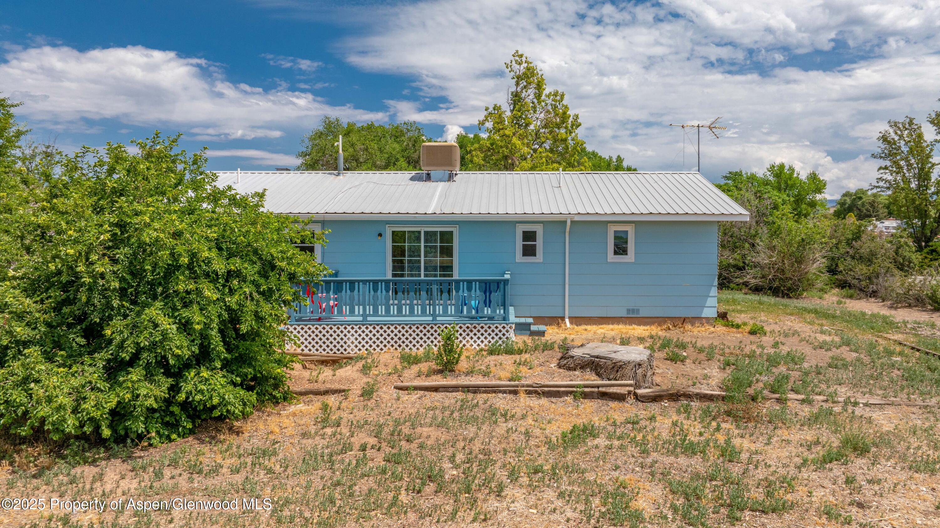 12303 West Spring Circle Eckert, CO 81418 - Photo 15 of 30 a front view of a house with garden