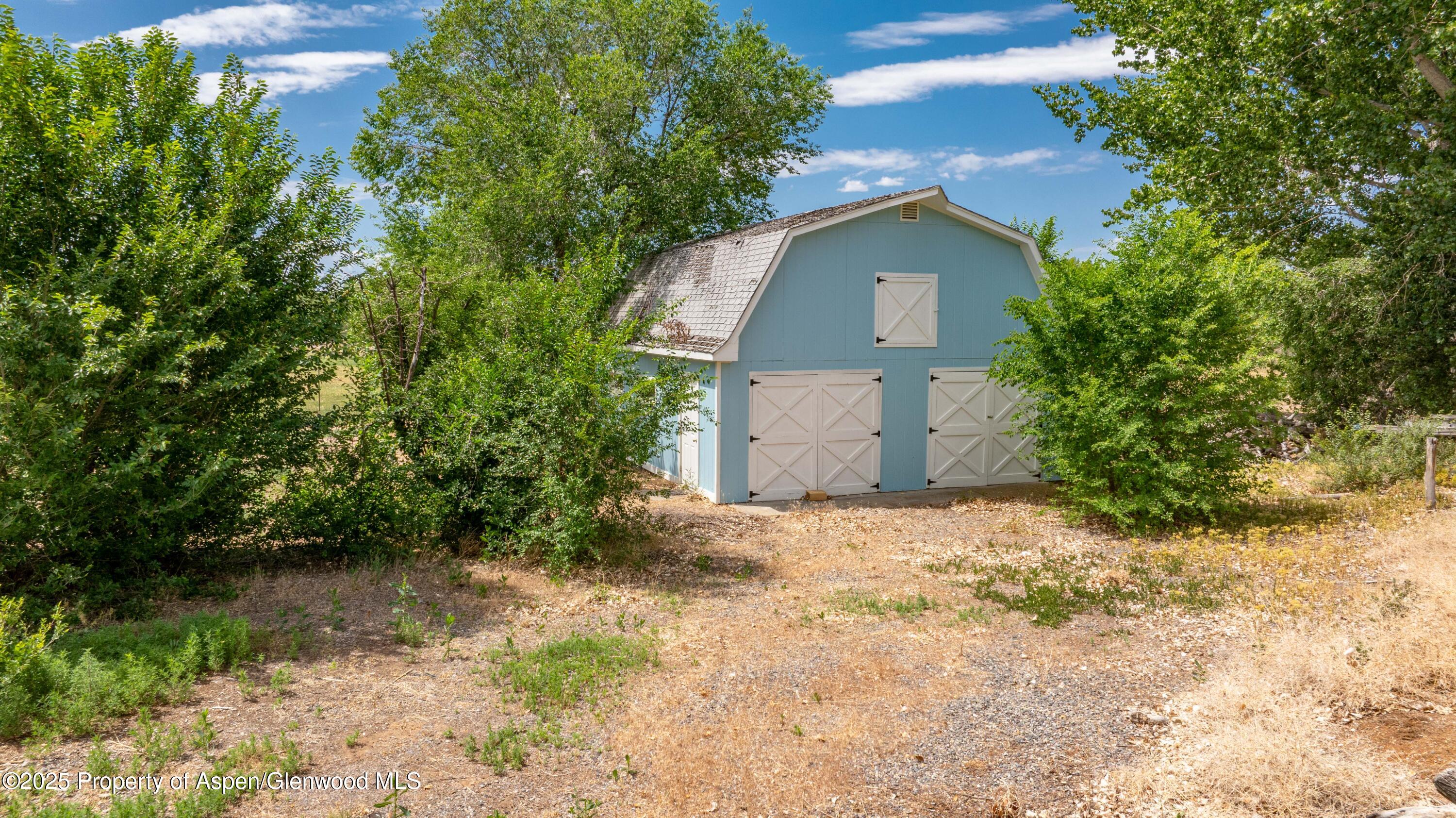 12303 West Spring Circle Eckert, CO 81418 - Photo 20 of 30 a house with trees in front of it
