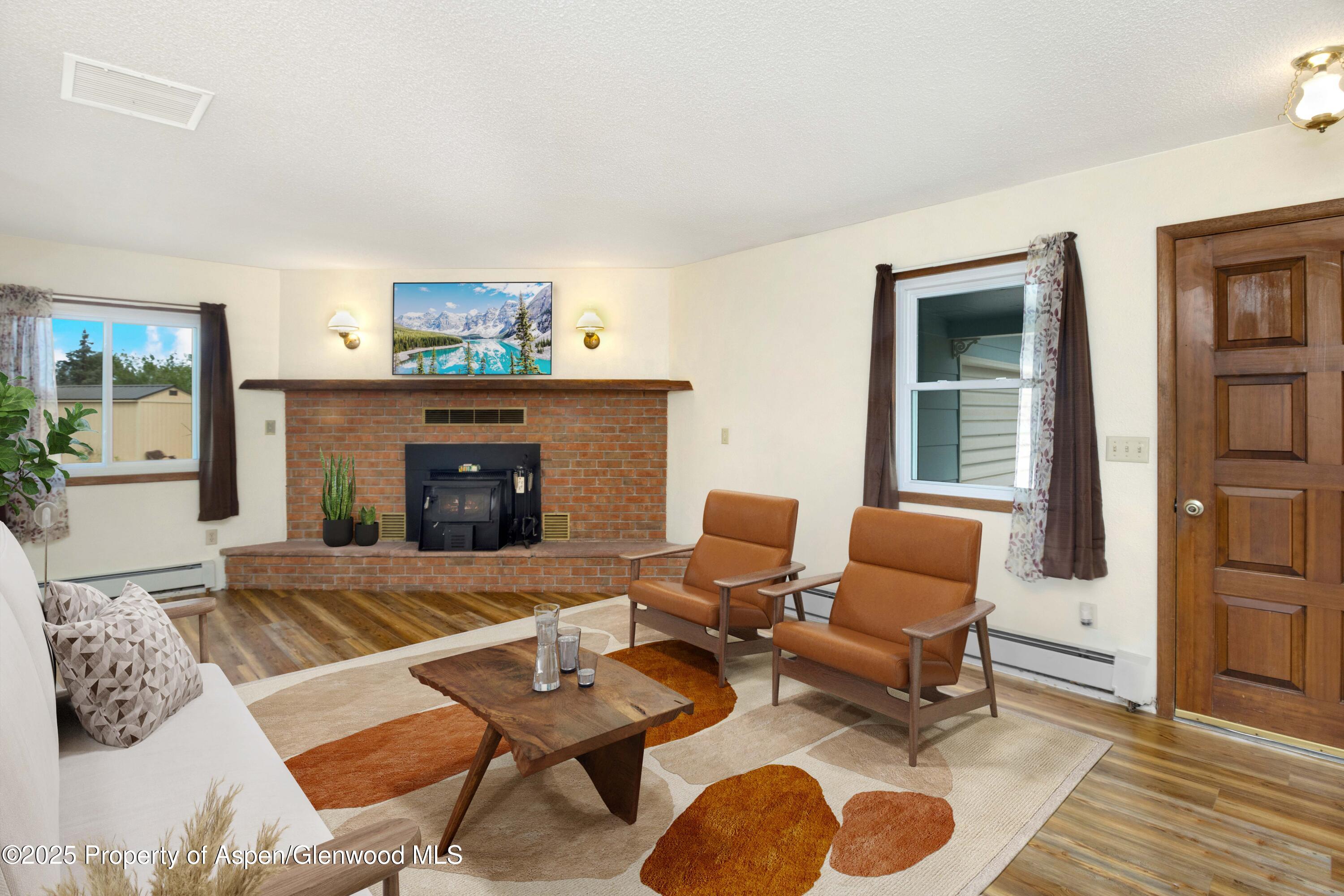 12303 West Spring Circle Eckert, CO 81418 - Photo 3 of 30 a living room with furniture and a fireplace