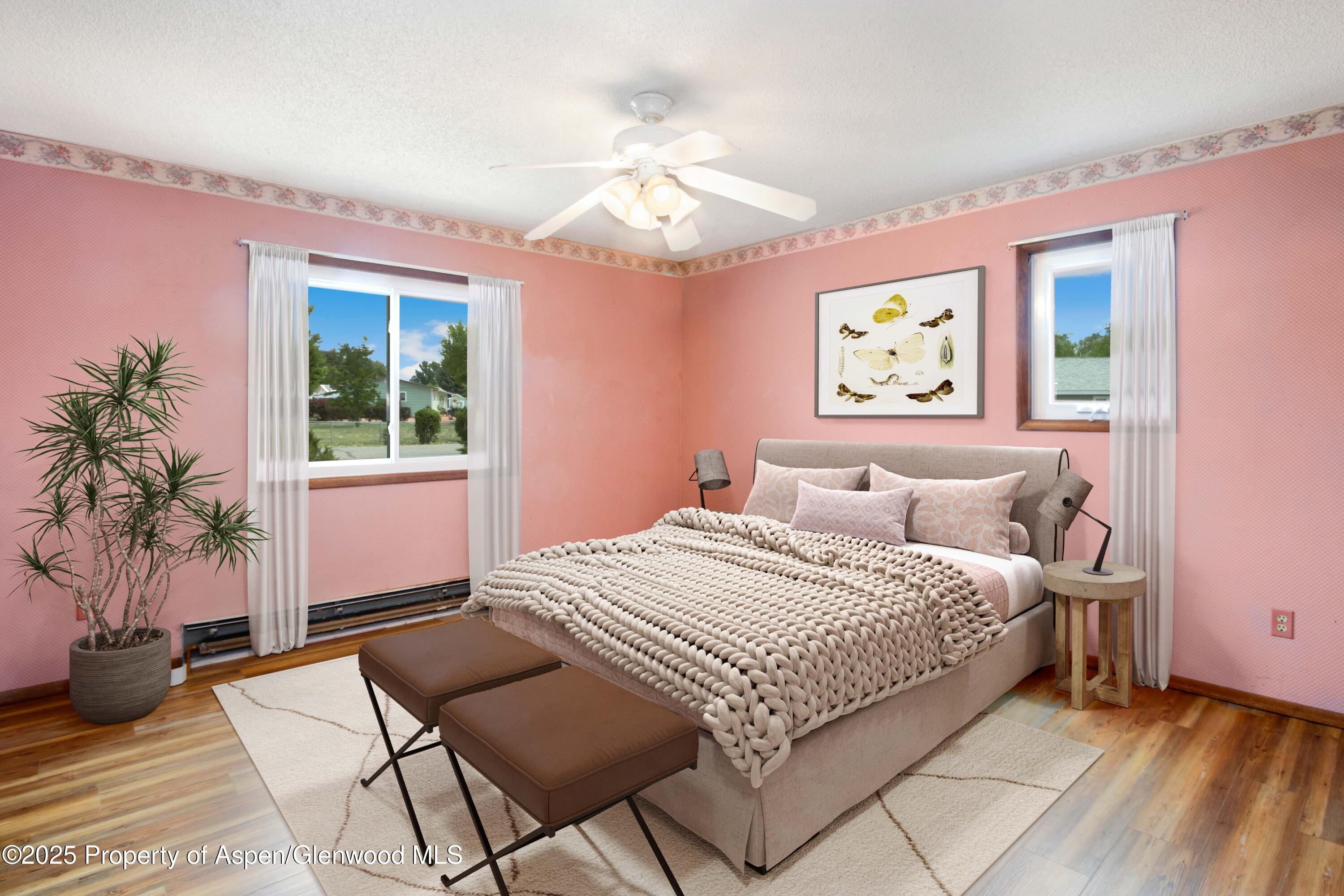 12303 West Spring Circle Eckert, CO 81418 - Photo 6 of 30 a bedroom with a large bed and a chandelier