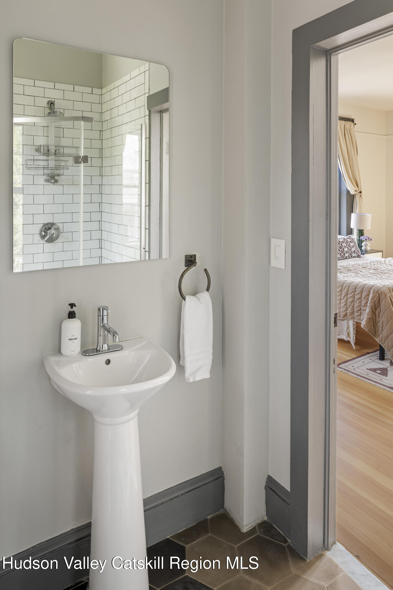 308 Main Street Catskill, NY 12414 - Photo 17 of 30 a bathroom with a sink a mirror and a window