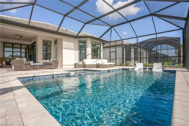 a swimming pool with patio outdoor seating space