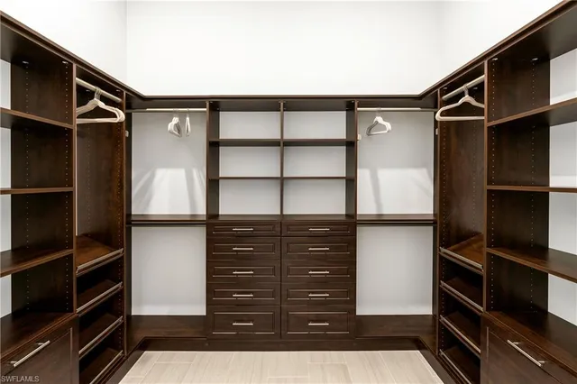 a bedroom with a bed and furniture