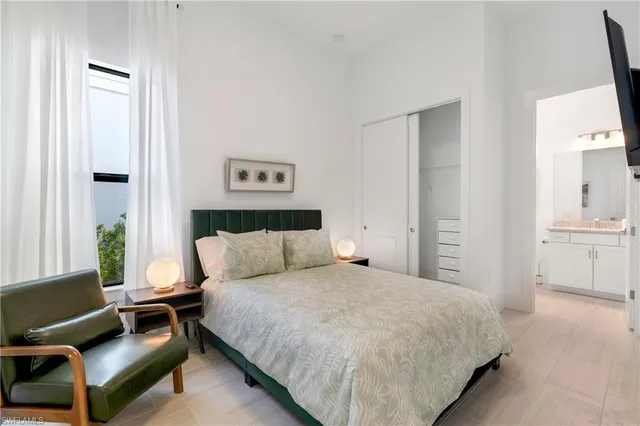 a bathroom with a granite countertop toilet a sink and a bathtub