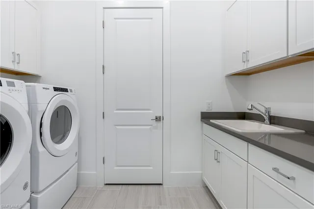a view of a house with pool and sitting area