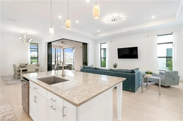 a kitchen with center island table and chairs