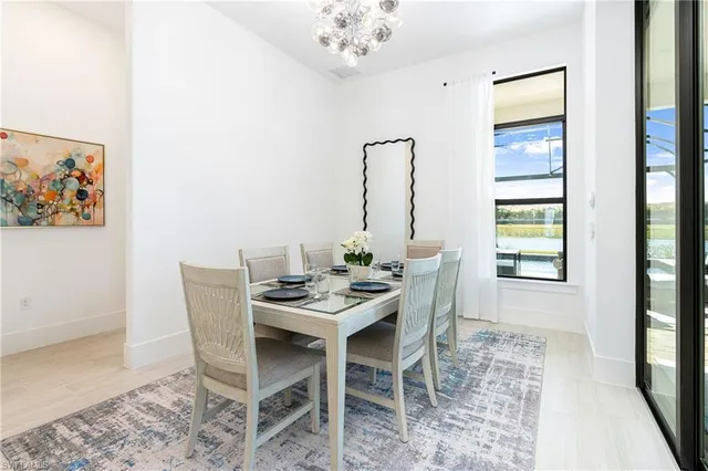 a dining room with furniture and window