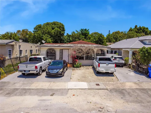 a car parked in front of a house