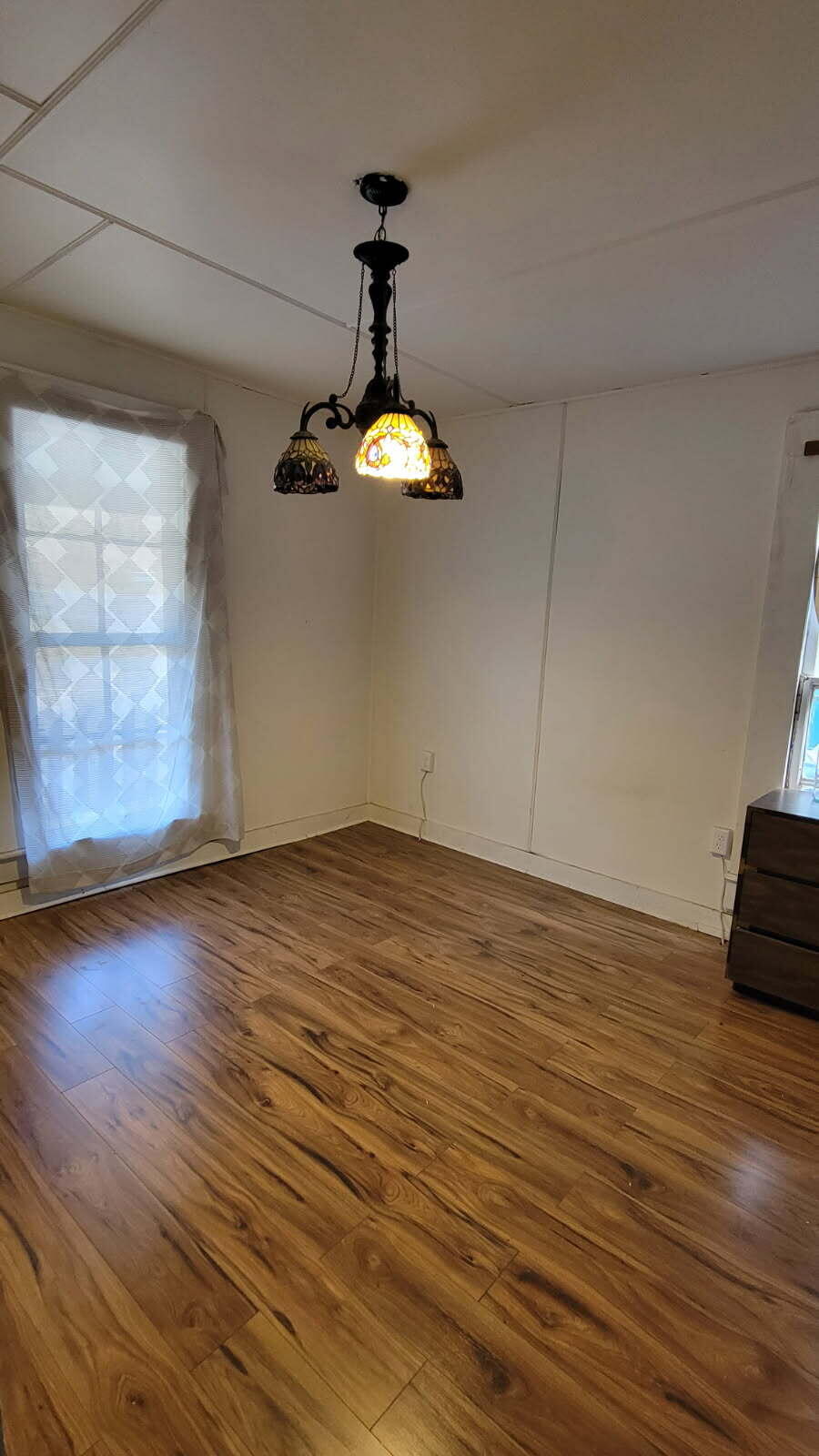 126 South Nelson Street Mitchell, OR 97750 - Photo 5 of 10 an empty room with wooden floor and windows