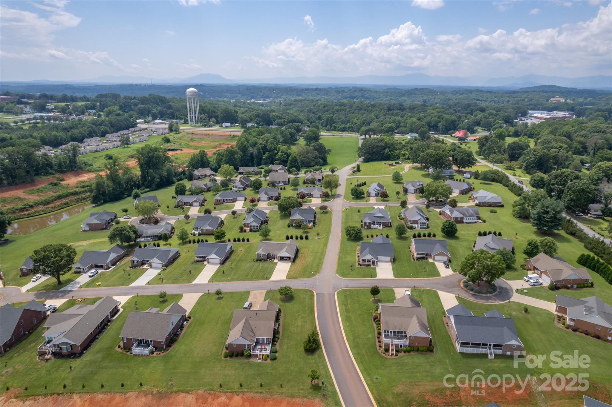 0 Grand Central Street, Unit 83 Spindale, NC 28160 - Photo 12 of 18 an aerial view of residential houses with outdoor space
