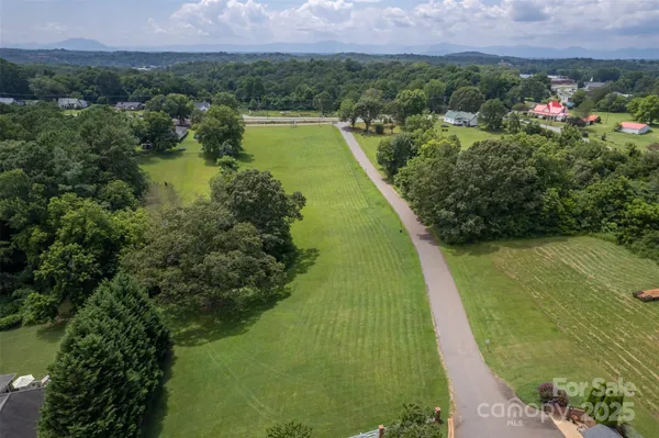 a view of a lake with a yard