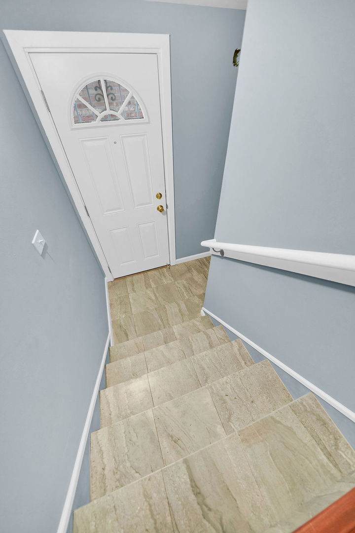 7234 South Ridgeway Avenue Chicago, IL 60629 - Photo 18 of 27 a view of staircase with white walls