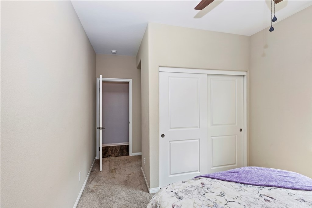 28212 Rustling Wind Circle Menifee, CA 92585 - Photo 13 of 28 a bedroom with a bed and a window
