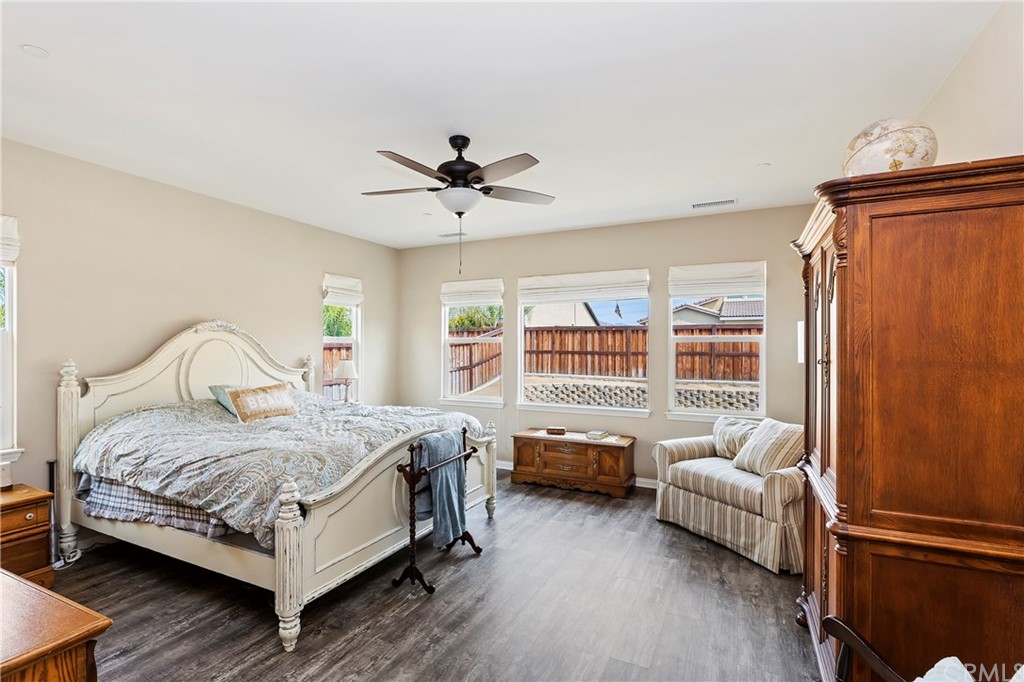 28212 Rustling Wind Circle Menifee, CA 92585 - Photo 16 of 28 a bedroom with a bed couch and a window