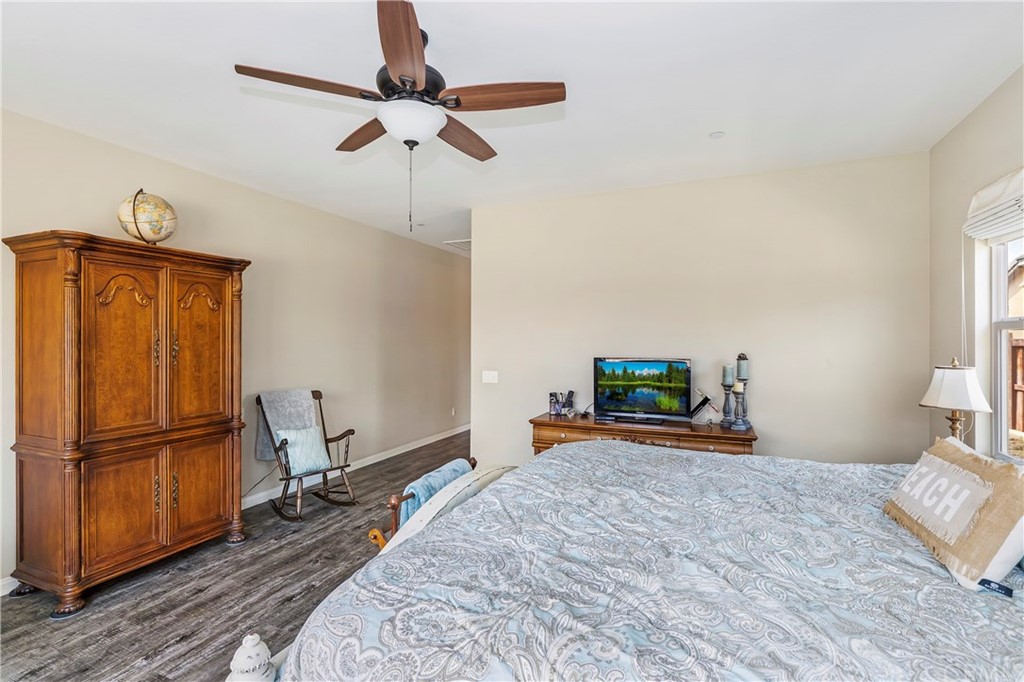 28212 Rustling Wind Circle Menifee, CA 92585 - Photo 17 of 28 a bedroom with a bed and a flat screen tv